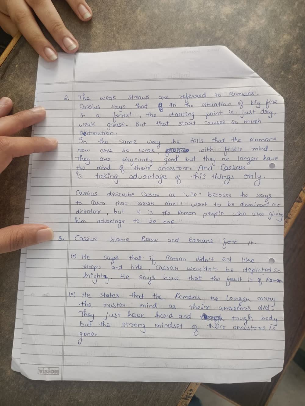 Page 2 of the handwritten answer sheet, photographed on a phone